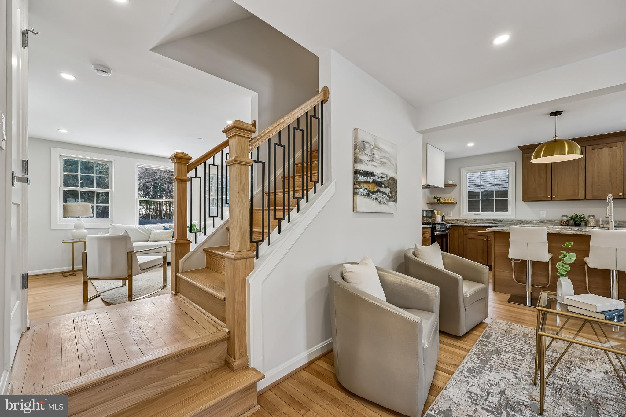 721 Mapleton Road Rockville, MD 20850 - Photo 11 of 36 a living room with furniture and a table