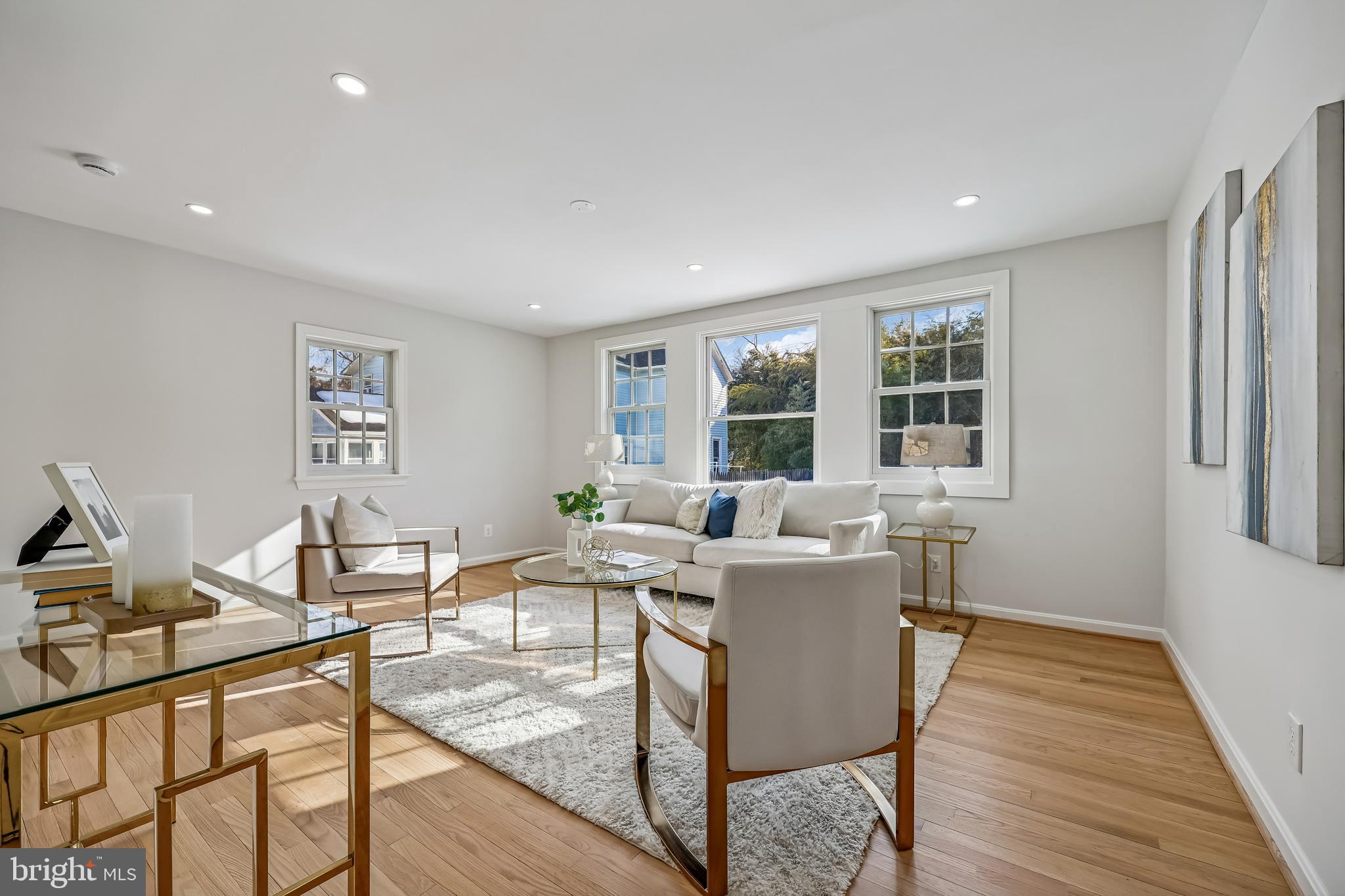 721 Mapleton Road Rockville, MD 20850 - Photo 13 of 36 a living room with a couch and wooden floor