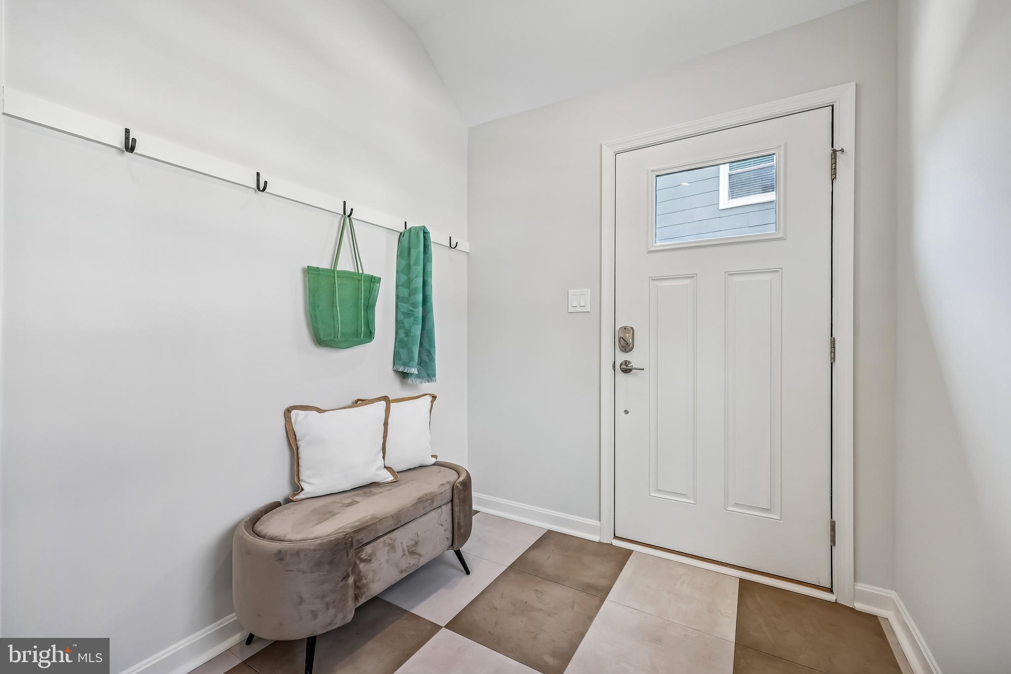 721 Mapleton Road Rockville, MD 20850 - Photo 18 of 36 a living room with furniture and a potted plant