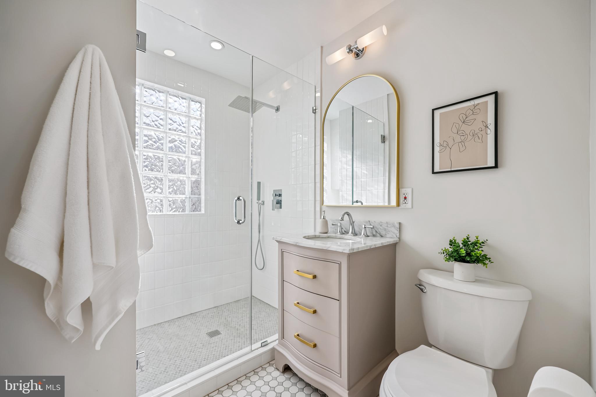 721 Mapleton Road Rockville, MD 20850 - Photo 19 of 36 a bathroom with a toilet sink and shower