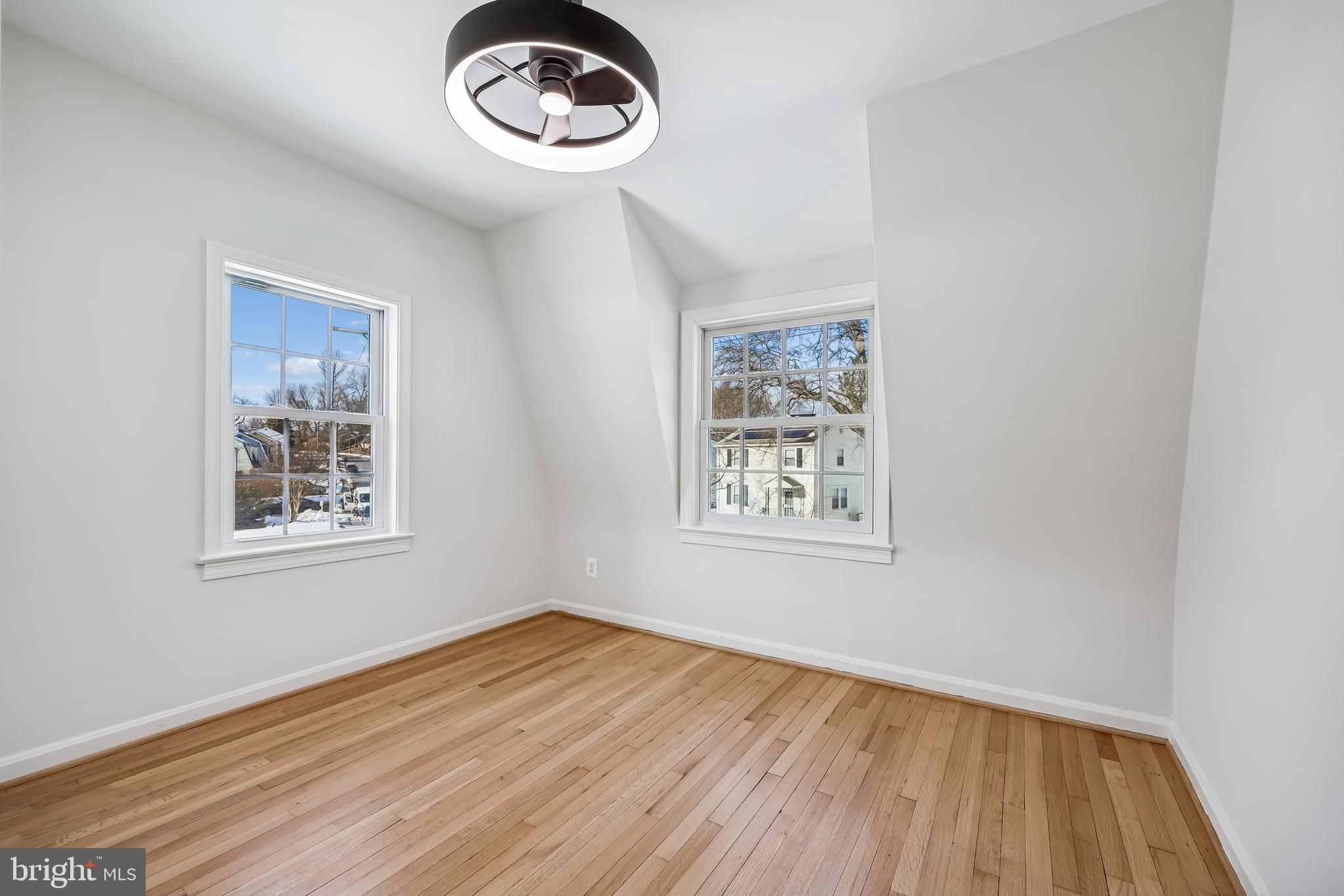 721 Mapleton Road Rockville, MD 20850 - Photo 26 of 36 a view of a room with wooden floor and window