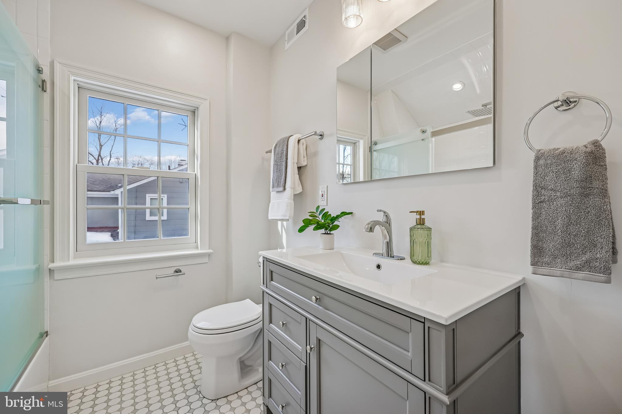 721 Mapleton Road Rockville, MD 20850 - Photo 28 of 36 a bathroom with a sink toilet and shower