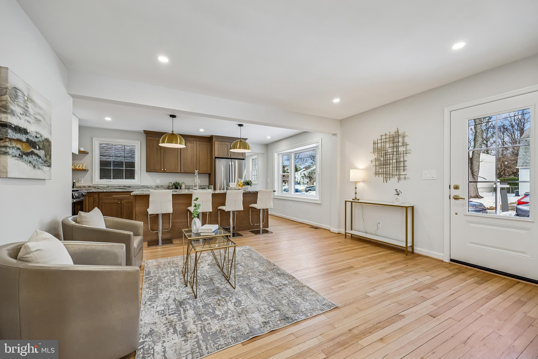 721 Mapleton Road Rockville, MD 20850 - Photo 3 of 36 a living room with furniture and a wooden floor