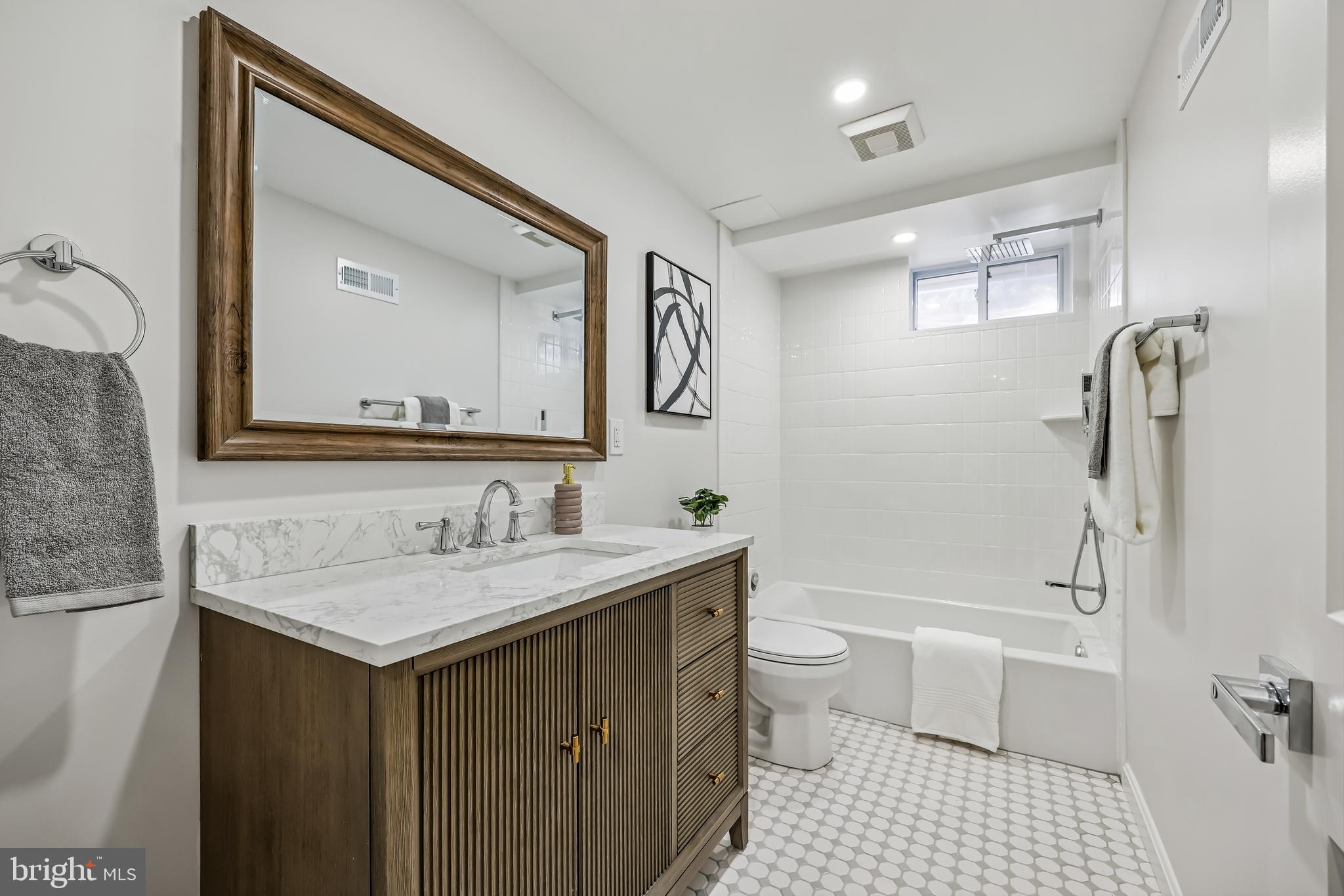 721 Mapleton Road Rockville, MD 20850 - Photo 32 of 36 a bathroom with a sink a toilet and shower