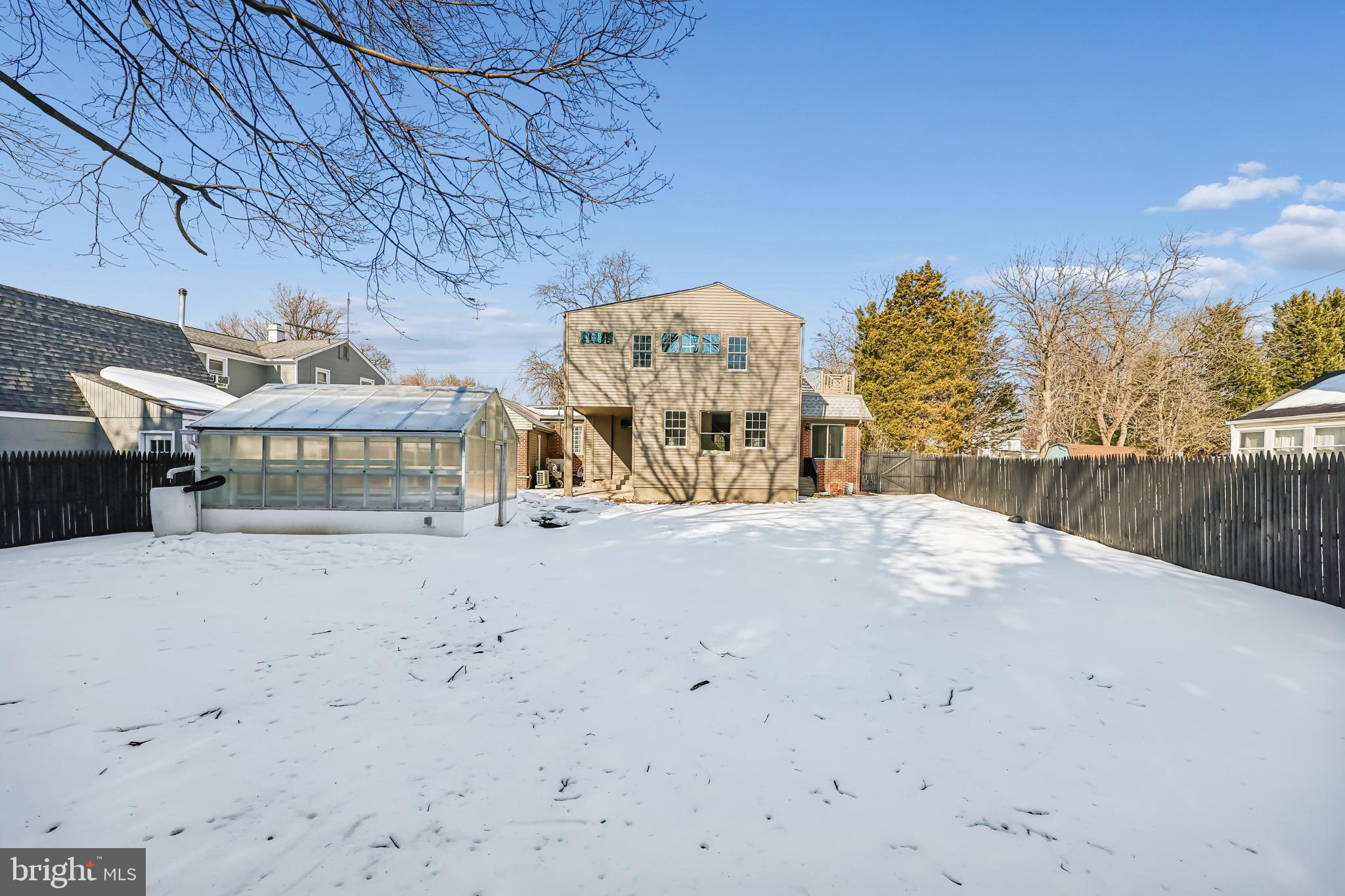 721 Mapleton Road Rockville, MD 20850 - Photo 33 of 36 a front view of a building with large trees