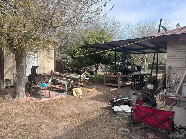 a view of a chairs and table in a patio