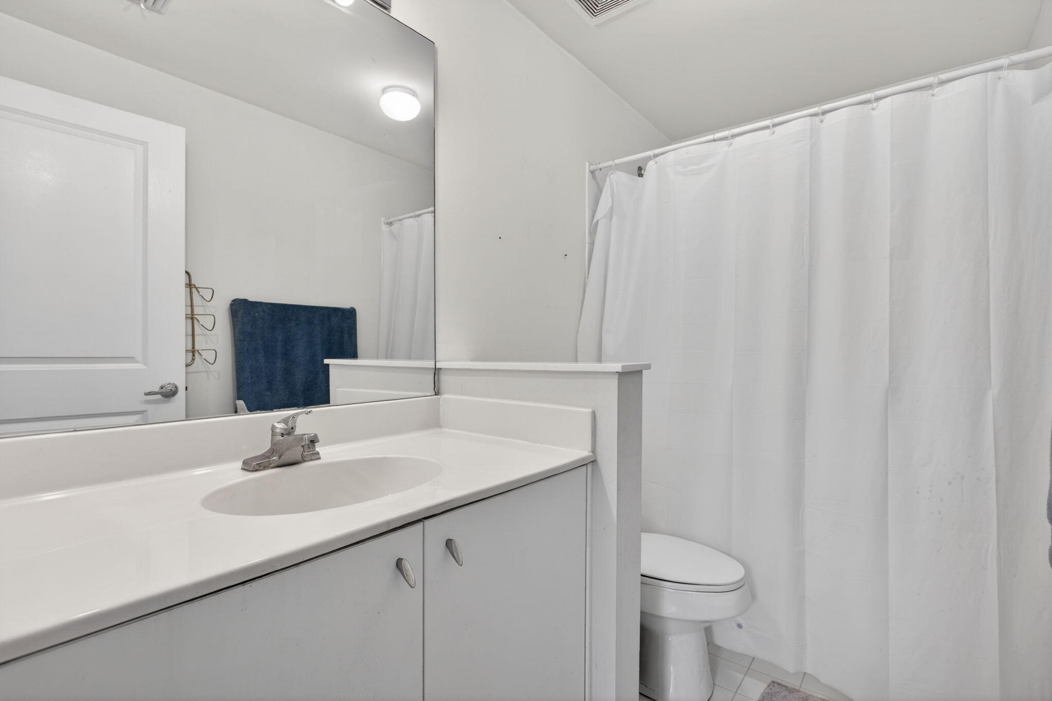 5880 West Sample Road, Unit 206 Coral Springs, FL 33067 - Photo 30 of 37 a bathroom with a sink and a mirror