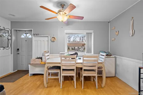 a dining room with furniture and window
