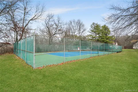 a view of a park with large trees