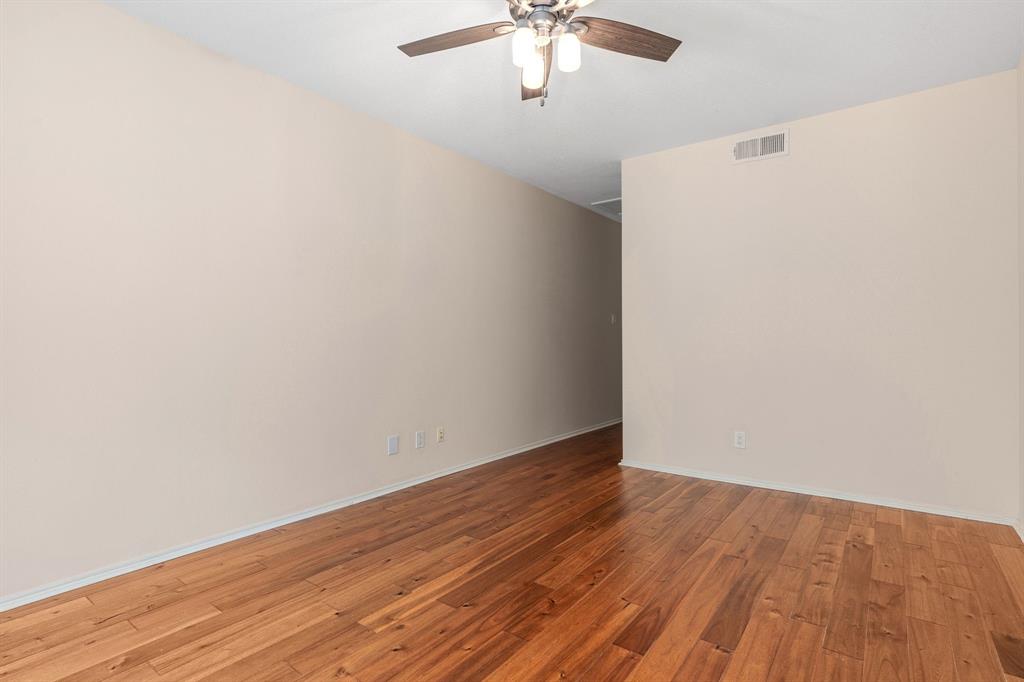 12660 Hillcrest Road, Unit 4203 Dallas, TX 75230 - Photo 14 of 16 Spare room with ceiling fan and light hardwood / wood-style floors