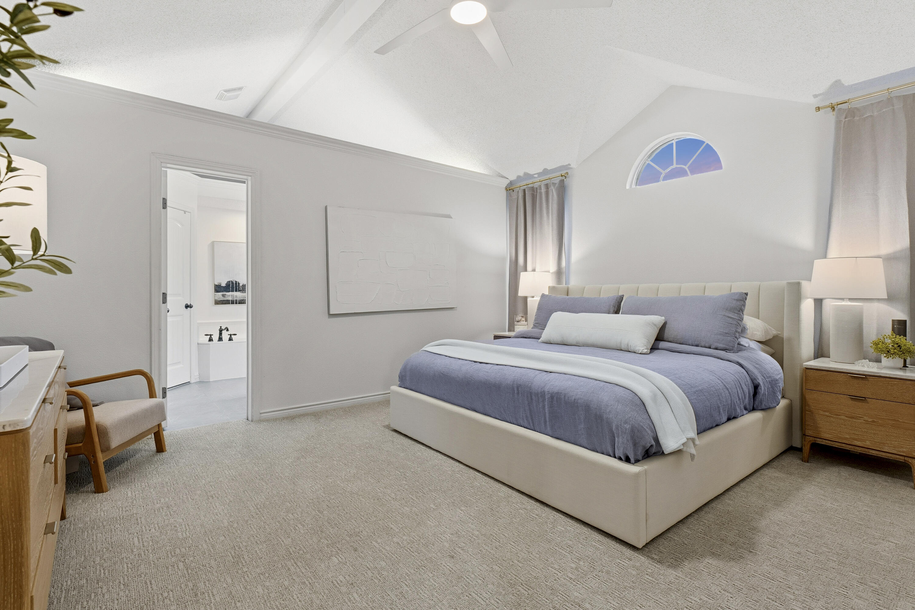 5830 101st Street Lubbock, TX 79424 - Photo 12 of 26 a spacious bedroom with a bed and a lamp