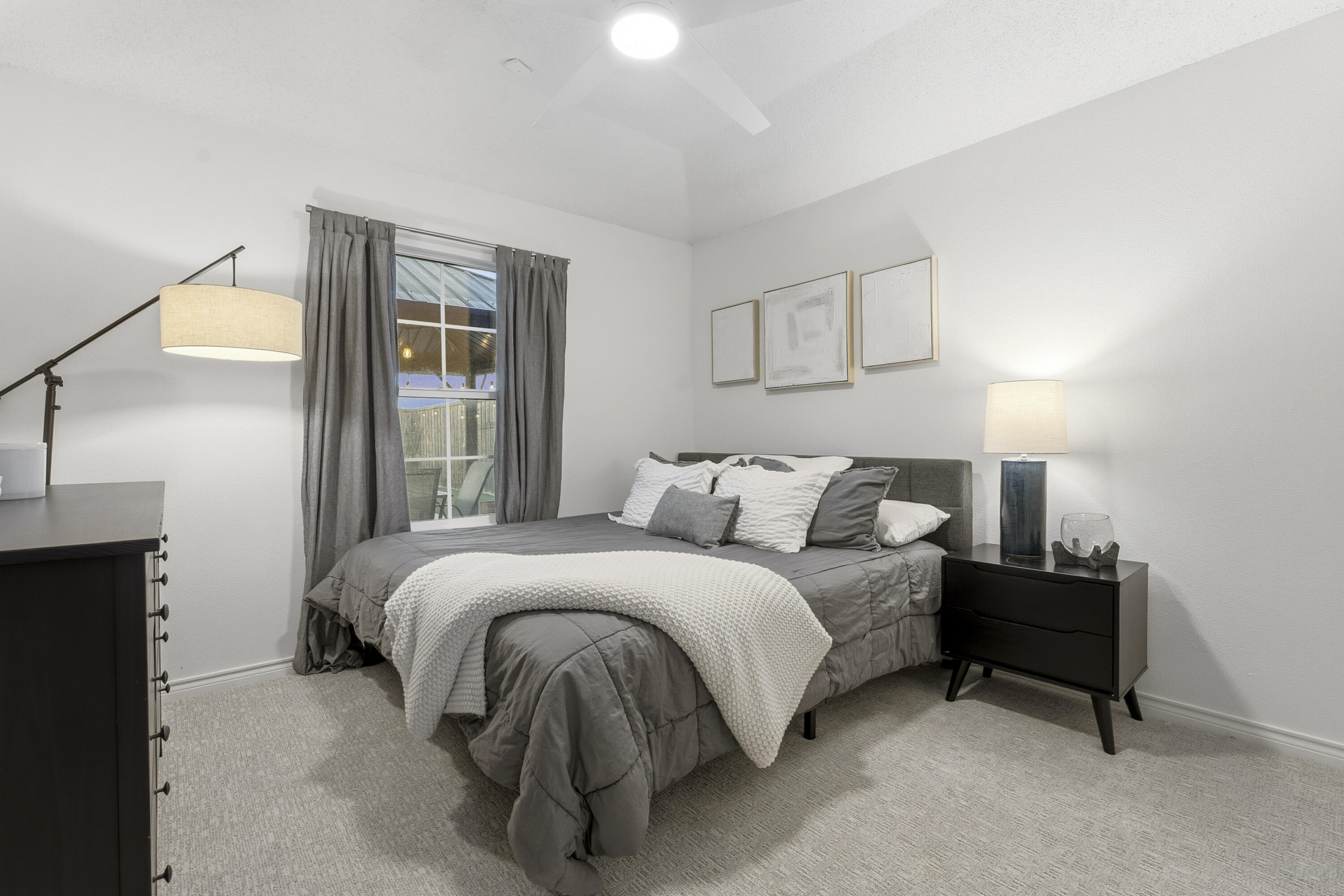 5830 101st Street Lubbock, TX 79424 - Photo 20 of 26 a bedroom with a bed and a night stand