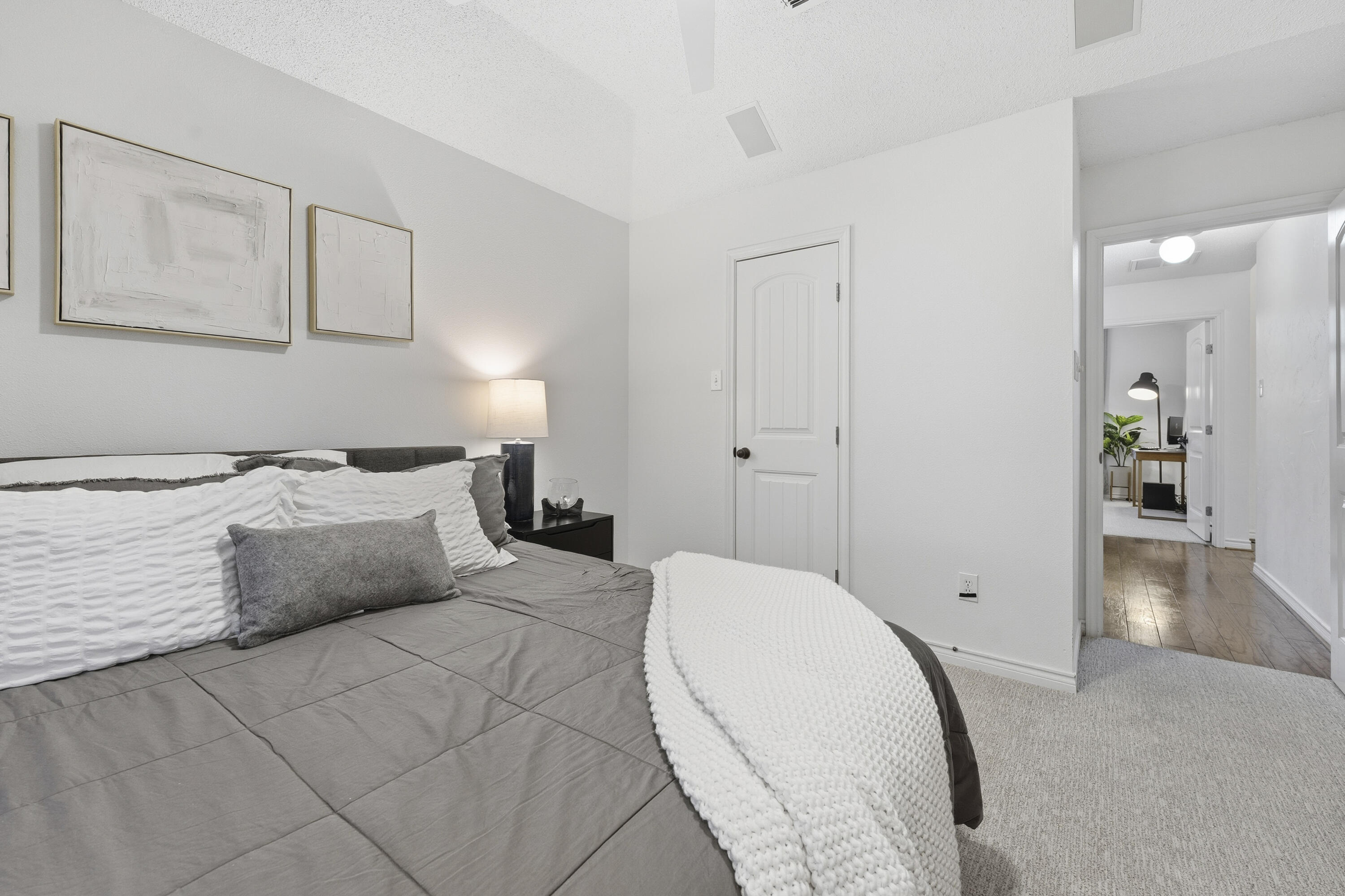 5830 101st Street Lubbock, TX 79424 - Photo 21 of 26 a bedroom with a bed and walk in closet