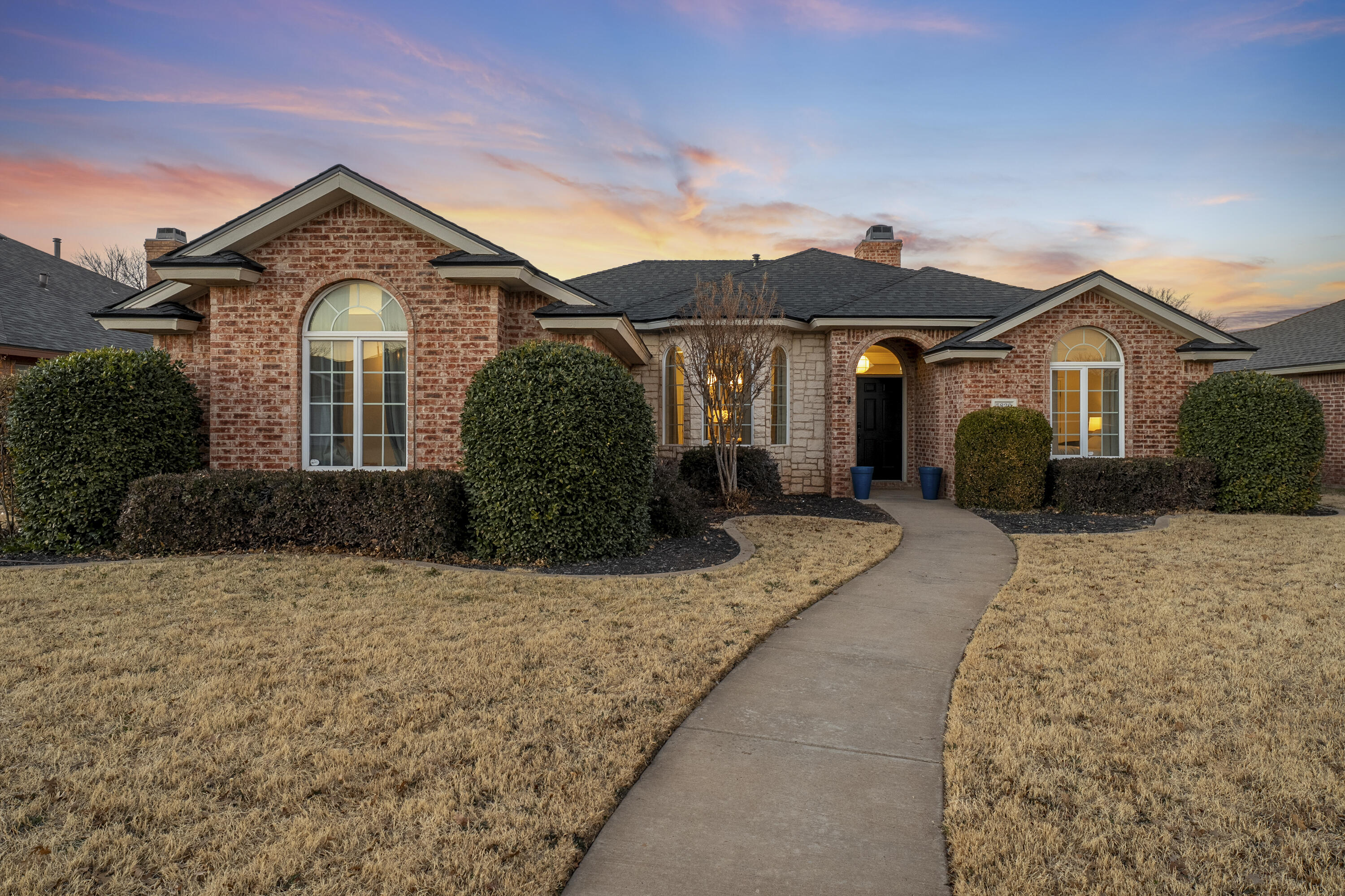 5830 101st Street Lubbock, TX 79424 - Photo 26 of 26 a front view of a house with a yard