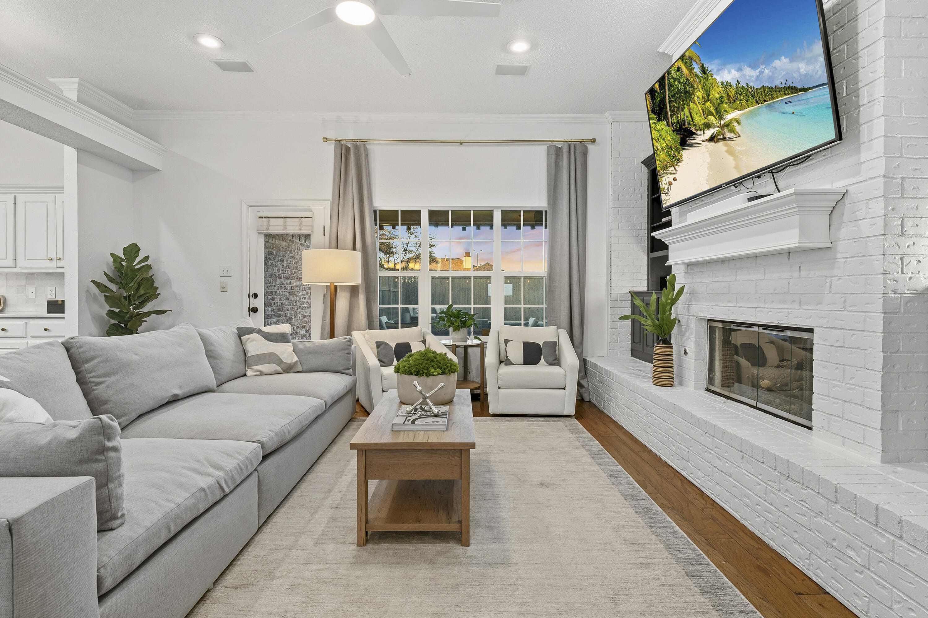 5830 101st Street Lubbock, TX 79424 - Photo 6 of 26 a living room with furniture large window and a fireplace