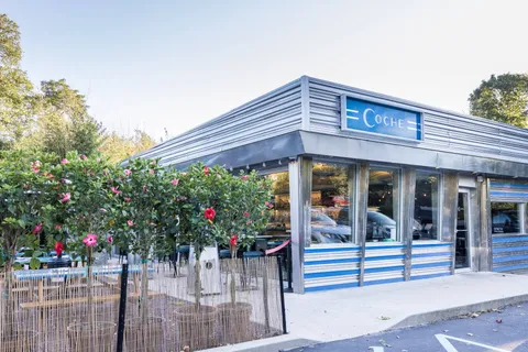 an outdoor view of a house with a porch