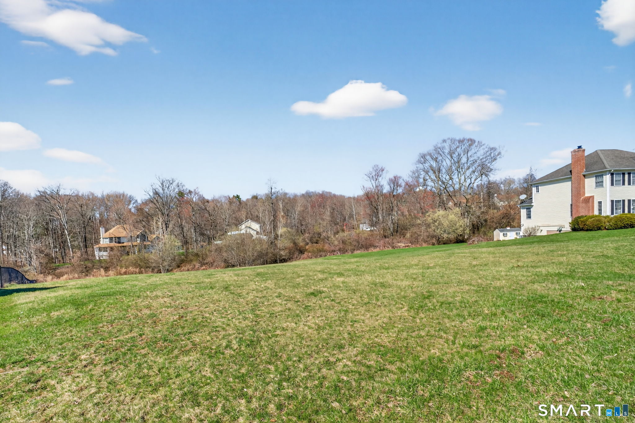 170 Debbie Drive Meriden, CT 06451 - Photo 7 of 19 a view of a house with a big yard and large trees
