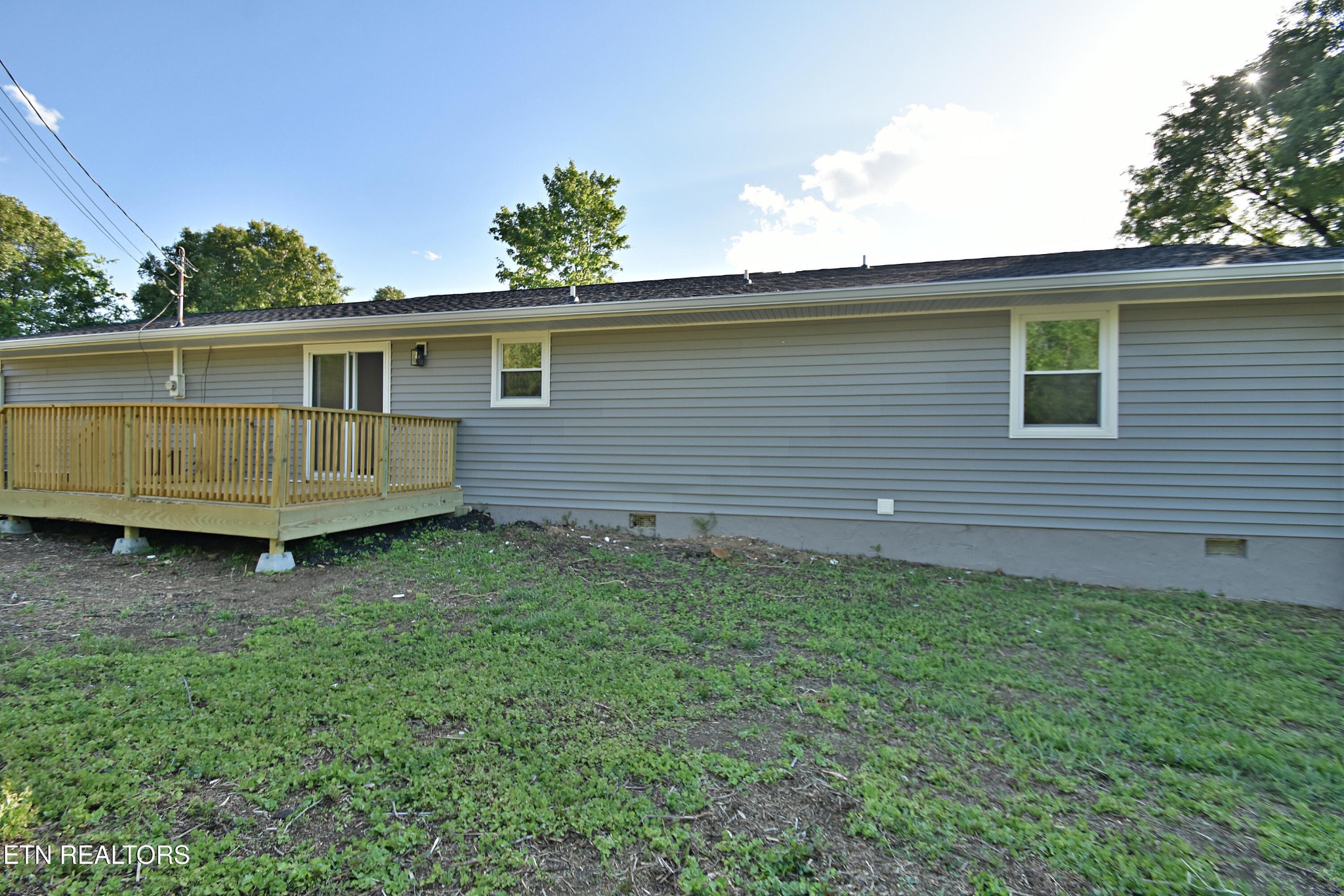 1119 Rudd Road Greenback, TN 37742 - Photo 25 of 28 a view of backyard with a garden and deck
