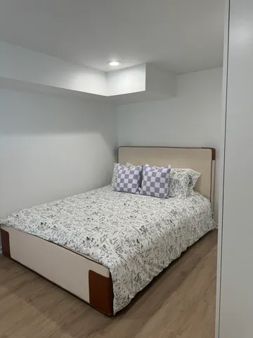 a close up of a bed in a room