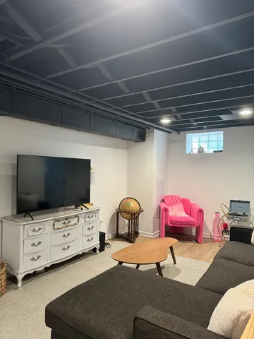 a room with furniture and flat screen tv