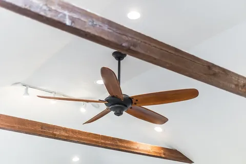 a bedroom with a bed and a window with outer view