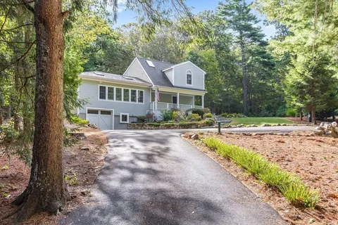 aerial view of a house with a yard