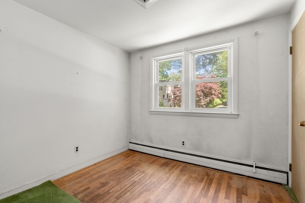 37 Freemont Street Lexington, MA 02421 - Photo 14 of 21 wooden floor in an empty room with a window