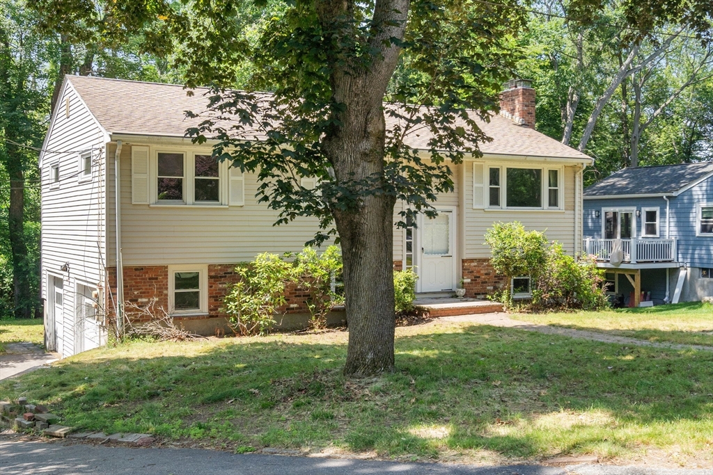 37 Freemont Street Lexington, MA 02421 - Photo 7 of 21 a front view of a house with a yard