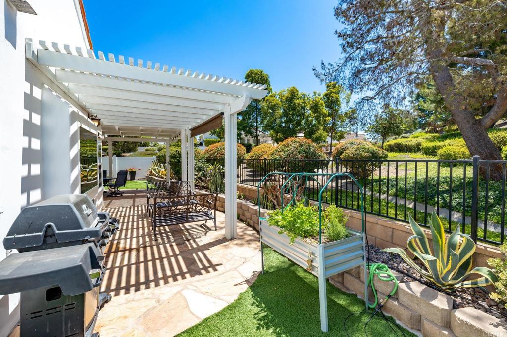 4939 Tilos Way Oceanside, CA 92056 - Photo 29 of 49 a view of a chairs and table in a patio