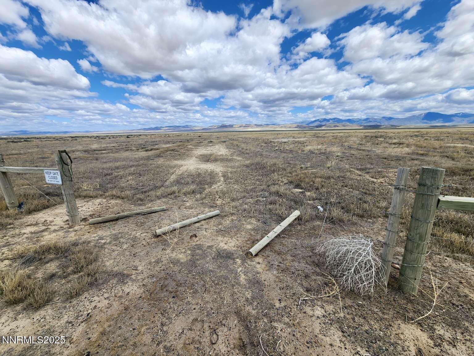 0 Crescent Ave Crescent Valley Crescent Valley, NV 89821 - Photo 11 of 23 a view of a dry yard with wooden fence