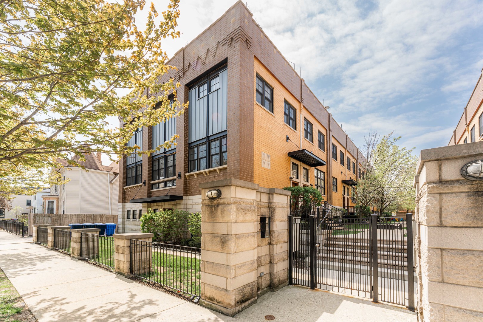 2060 North Stave Street, Unit 9 Chicago, IL 60647 - Photo 1 of 31 a city view with tall buildings and a yard