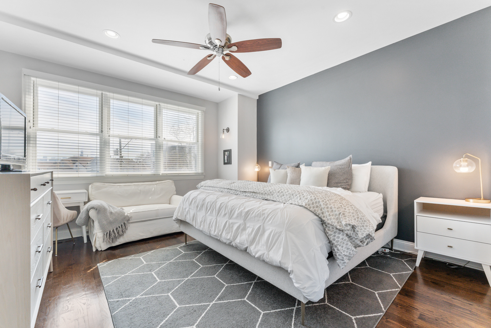 2060 North Stave Street, Unit 9 Chicago, IL 60647 - Photo 15 of 31 a bedroom with a bed and a large window