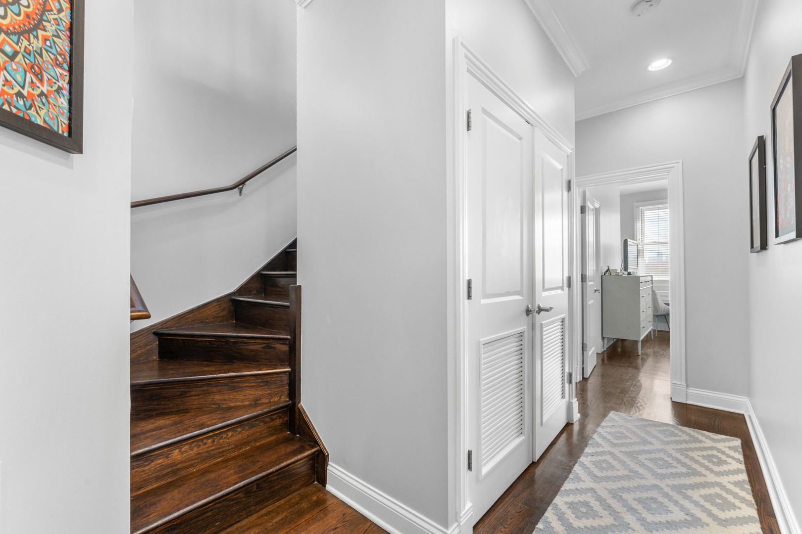 2060 North Stave Street, Unit 9 Chicago, IL 60647 - Photo 18 of 31 a view of a hallway with closet and wooden floor