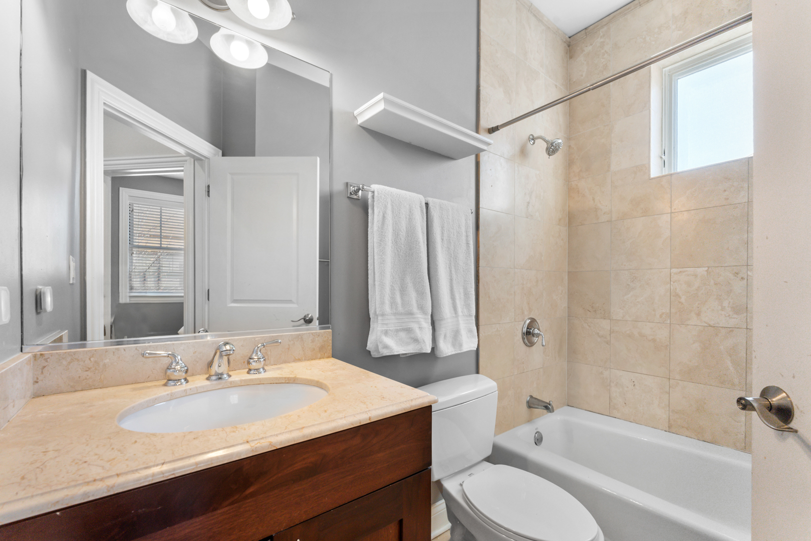 2060 North Stave Street, Unit 9 Chicago, IL 60647 - Photo 21 of 31 a bathroom with a granite countertop sink toilet mirror and a bathtub