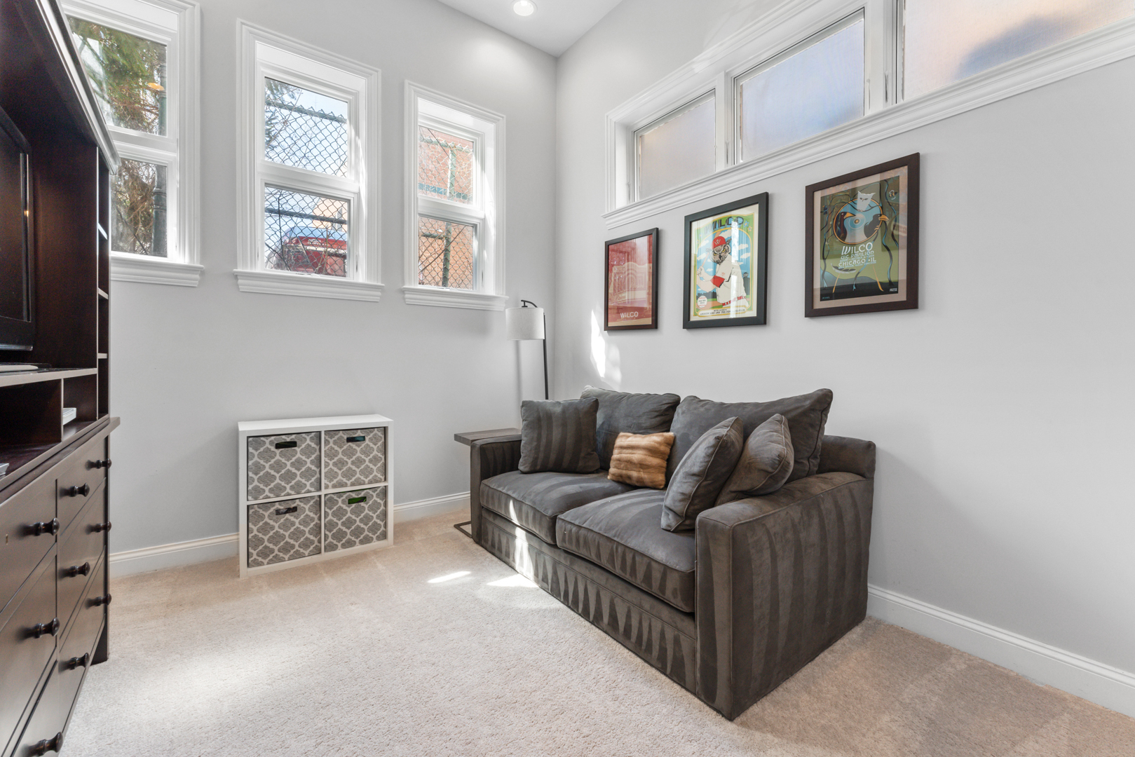 2060 North Stave Street, Unit 9 Chicago, IL 60647 - Photo 28 of 31 a living room with furniture and a flat screen tv
