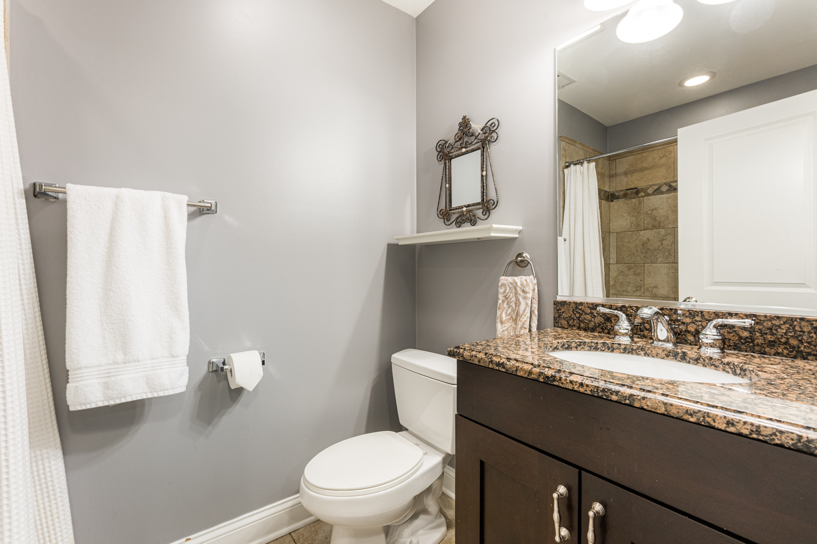 2060 North Stave Street, Unit 9 Chicago, IL 60647 - Photo 29 of 31 a bathroom with a granite countertop sink toilet and mirror
