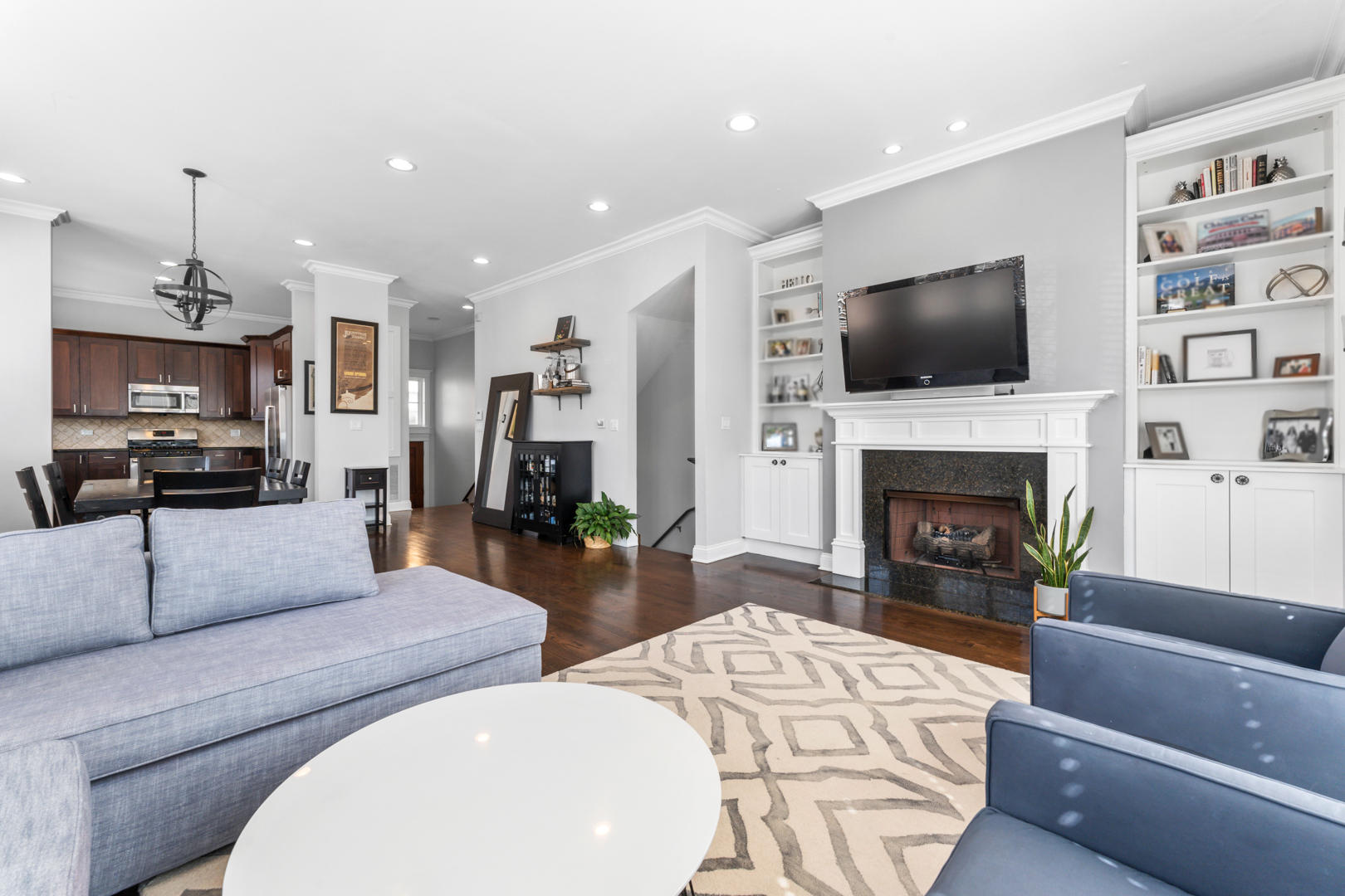 2060 North Stave Street, Unit 9 Chicago, IL 60647 - Photo 3 of 31 a living room with fireplace furniture and a flat screen tv