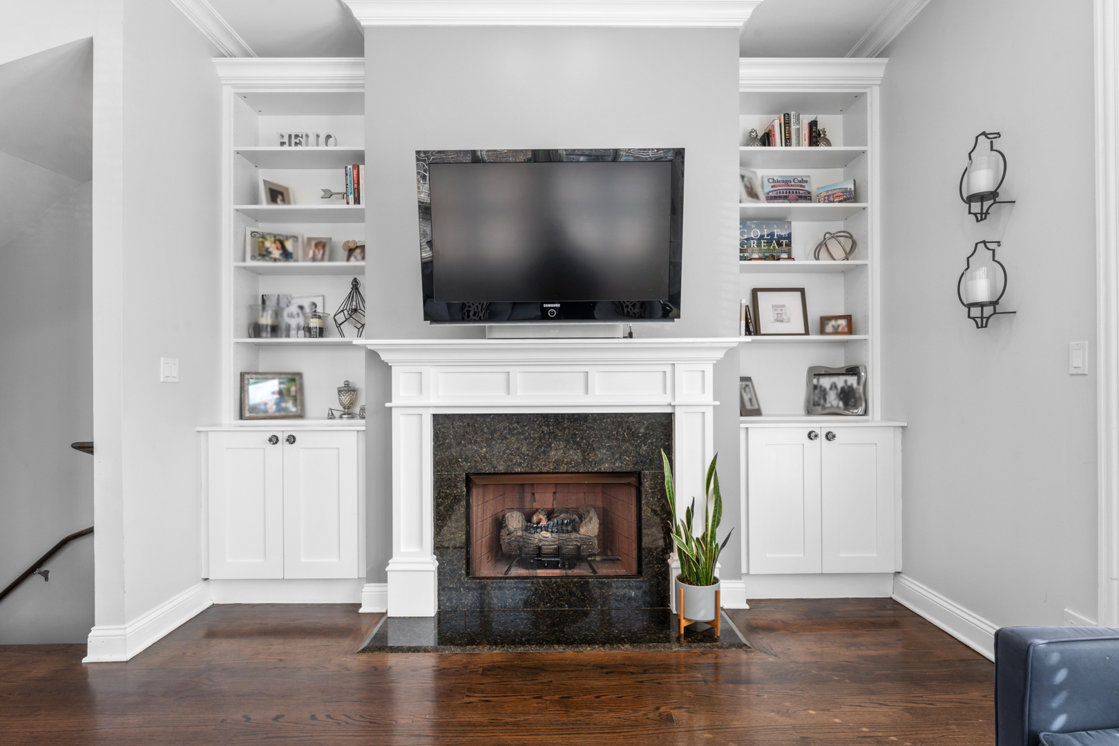 2060 North Stave Street, Unit 9 Chicago, IL 60647 - Photo 5 of 31 a living room with a fireplace and a flat screen tv