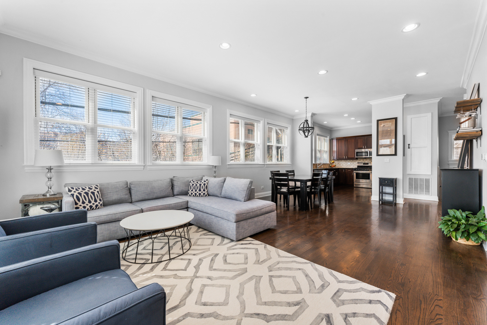 2060 North Stave Street, Unit 9 Chicago, IL 60647 - Photo 7 of 31 a living room with furniture and wooden floor