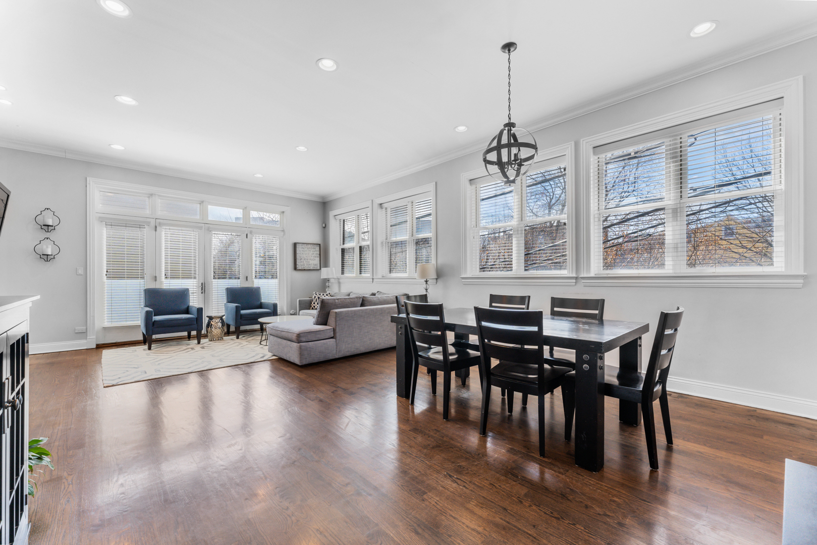 2060 North Stave Street, Unit 9 Chicago, IL 60647 - Photo 8 of 31 a view of a dining room with furniture window and wooden floor