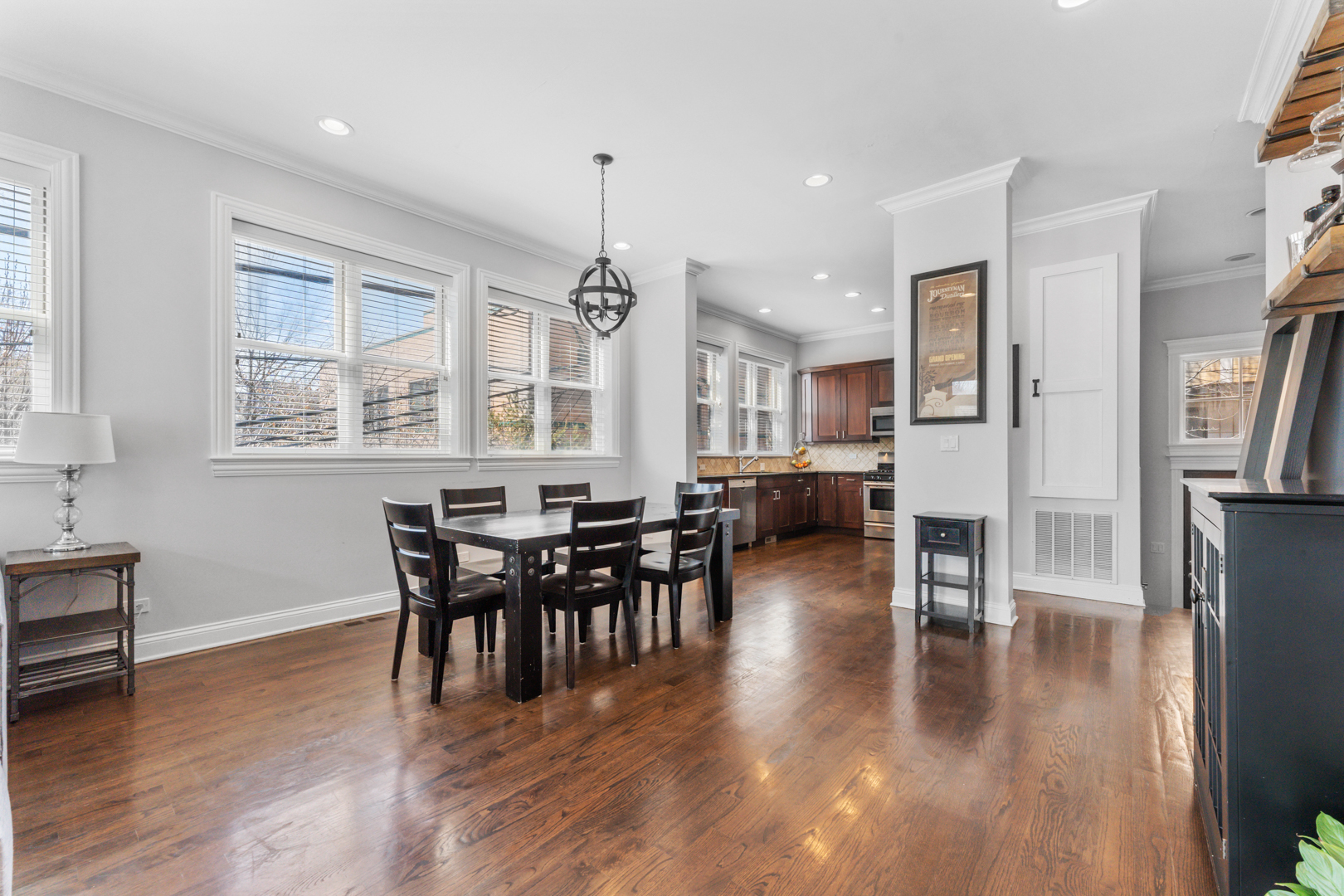 2060 North Stave Street, Unit 9 Chicago, IL 60647 - Photo 9 of 31 a view of a dining room with furniture window and wooden floor