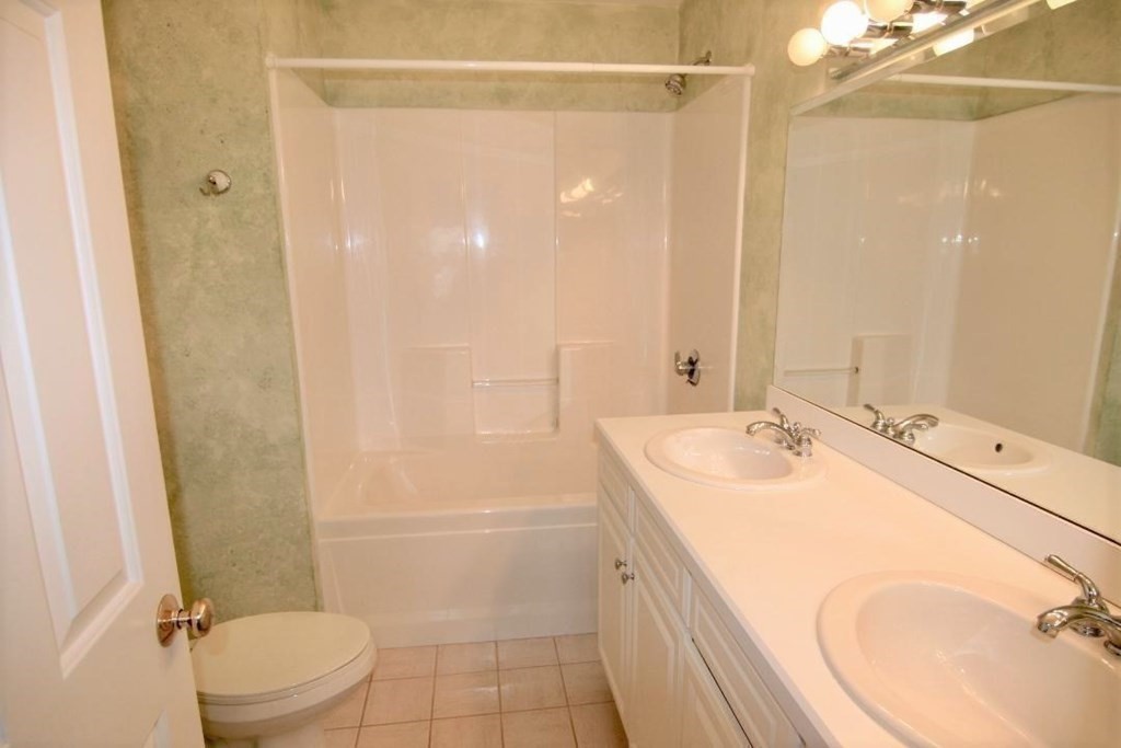 7 Conant Road, Unit 67 Winchester, MA 01890 - Photo 12 of 26 a bathroom with a sink a toilet and shower