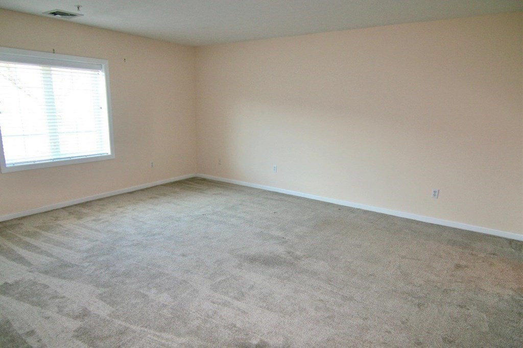 7 Conant Road, Unit 67 Winchester, MA 01890 - Photo 13 of 26 an empty room with a window