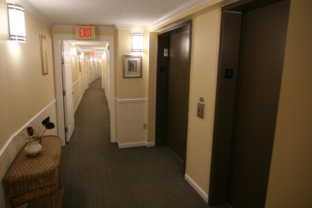 7 Conant Road, Unit 67 Winchester, MA 01890 - Photo 21 of 26 a view of elevator with hallway