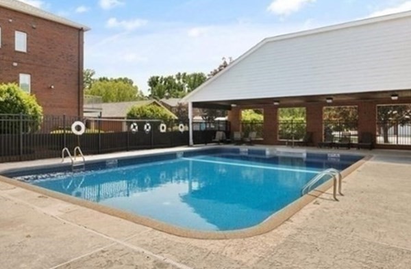 7 Conant Road, Unit 67 Winchester, MA 01890 - Photo 25 of 26 a view of a swimming pool with an outdoor seating