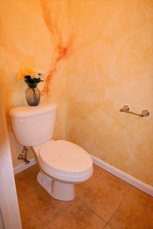 7 Conant Road, Unit 67 Winchester, MA 01890 - Photo 8 of 26 a bathroom with a toilet and a sink