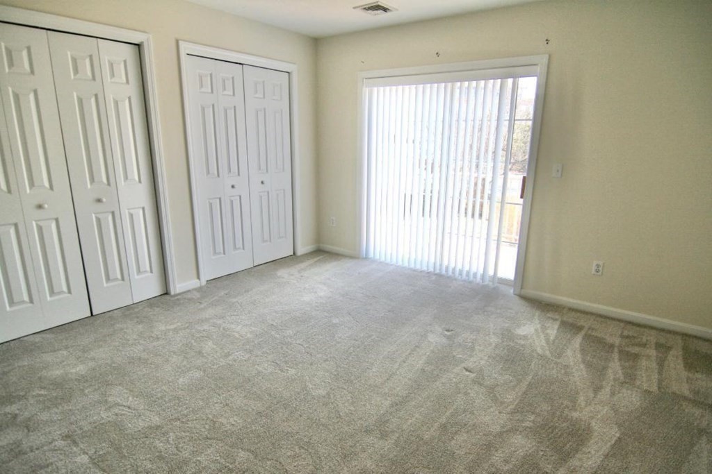 7 Conant Road, Unit 67 Winchester, MA 01890 - Photo 9 of 26 an empty room with windows