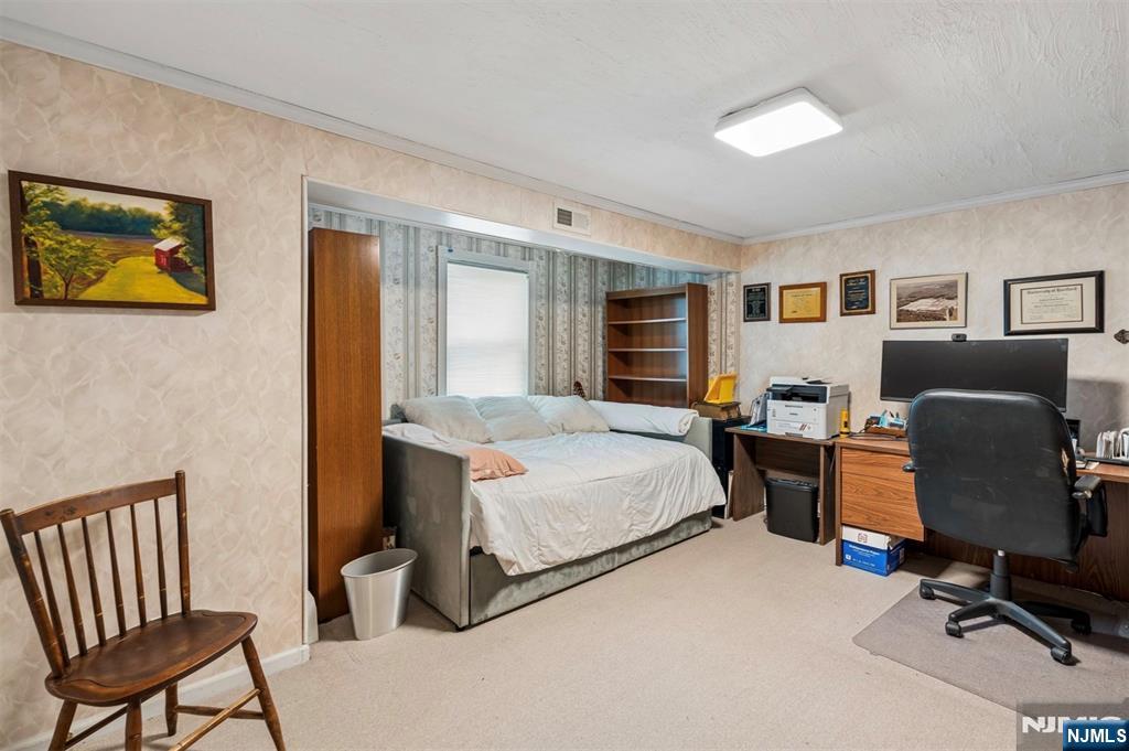6 Waters Edge Butler, NJ 07405 - Photo 18 of 28 a bedroom with a bed and wooden floor