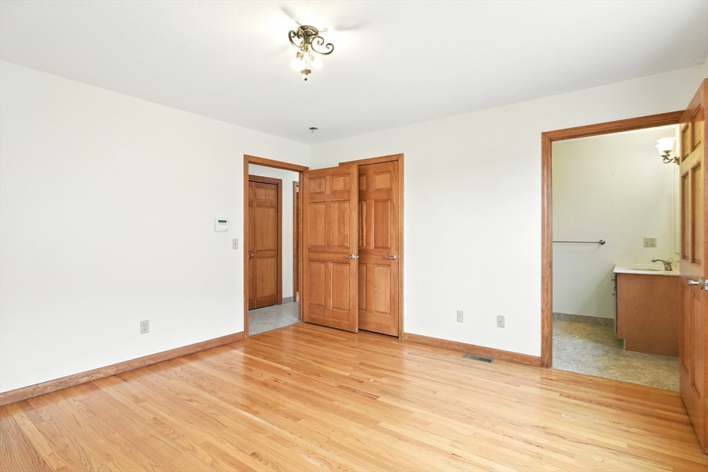 254 Island Pond Road Springfield, MA 01118 - Photo 19 of 26 a view of an empty room with wooden floor