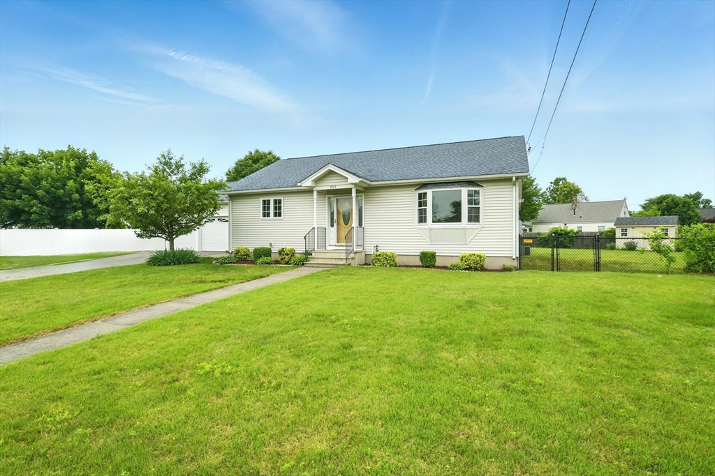 254 Island Pond Road Springfield, MA 01118 - Photo 2 of 26 a front view of house with yard and green space
